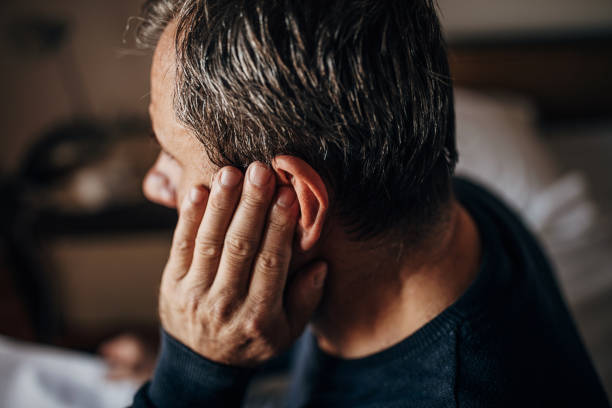 This is an illustration of an old man with hand on his ear. This is an indication of some level of hearing loss.